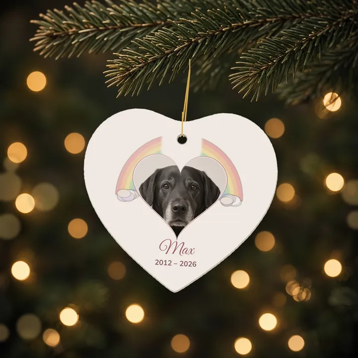 Heart-shaped memorial ornament with a black dog photo under a pastel rainbow, named Max, 2012 to 2026